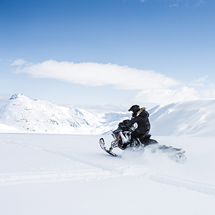 Person riding snow bike on Snow Beach  